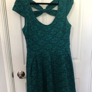 Woman’s dark green dress